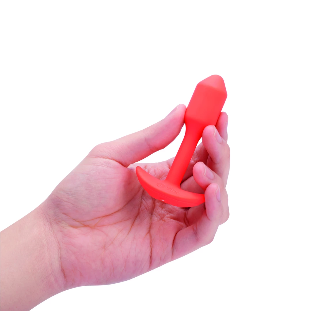 b-Vibe Snug Plug 1 vibruojantis analinis kaištis su svarmeniu, oranžinis